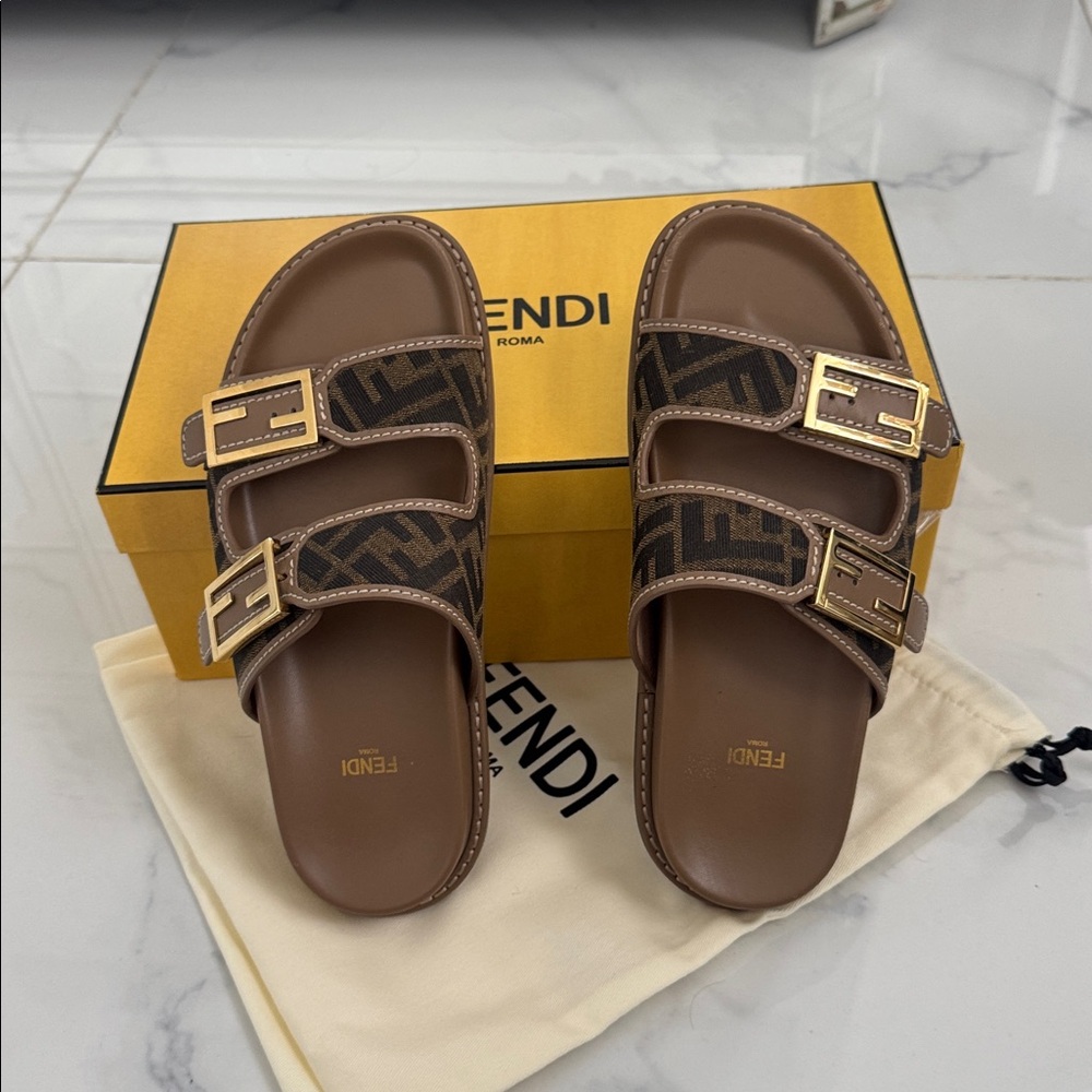 Authentic Fendi Tan and Black Logo Slide Sandals in excellent conditions.